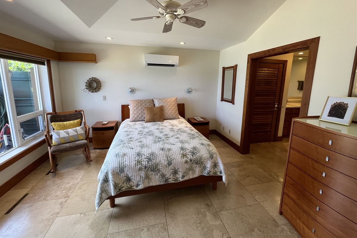 Master bedroom with views of white sand, turquoise water, & crashing waves