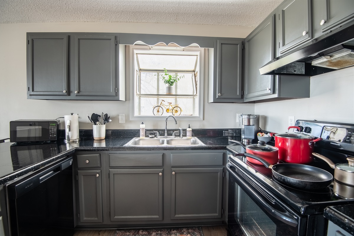 Unit A's full kitchen has plenty of natural lighting to enjoy slow mornings while sipping your coffee!