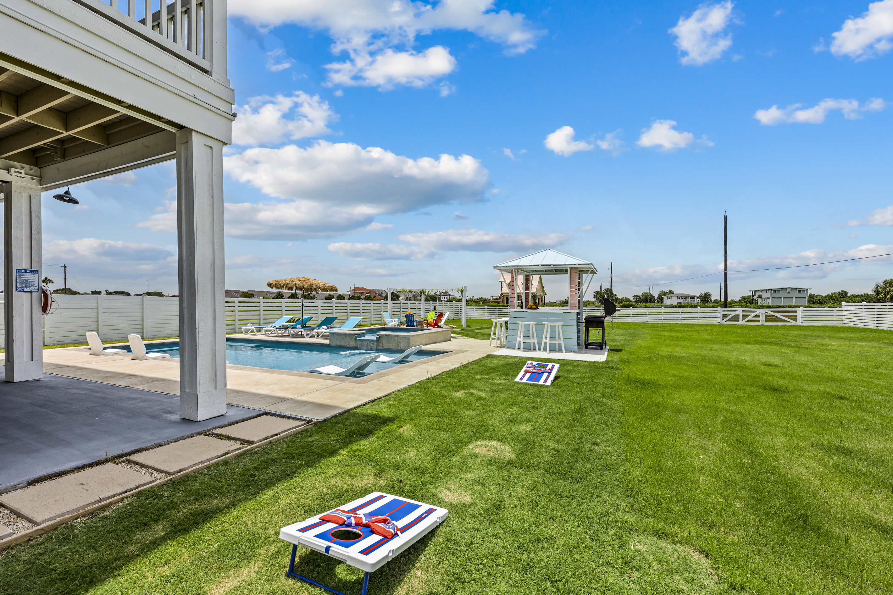 Backyard Games & Poolside Fun
Keep the fun going with a dedicated games area beside the pool and coastal gazebo. Challenge friends and family to a friendly competition while enjoying the perfect outdoor gathering space.