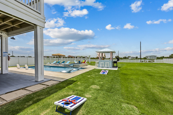 Backyard Games & Poolside Fun
Keep the fun going with a dedicated games area beside the pool and coastal gazebo. Challenge friends and family to a friendly competition while enjoying the perfect outdoor gathering space.