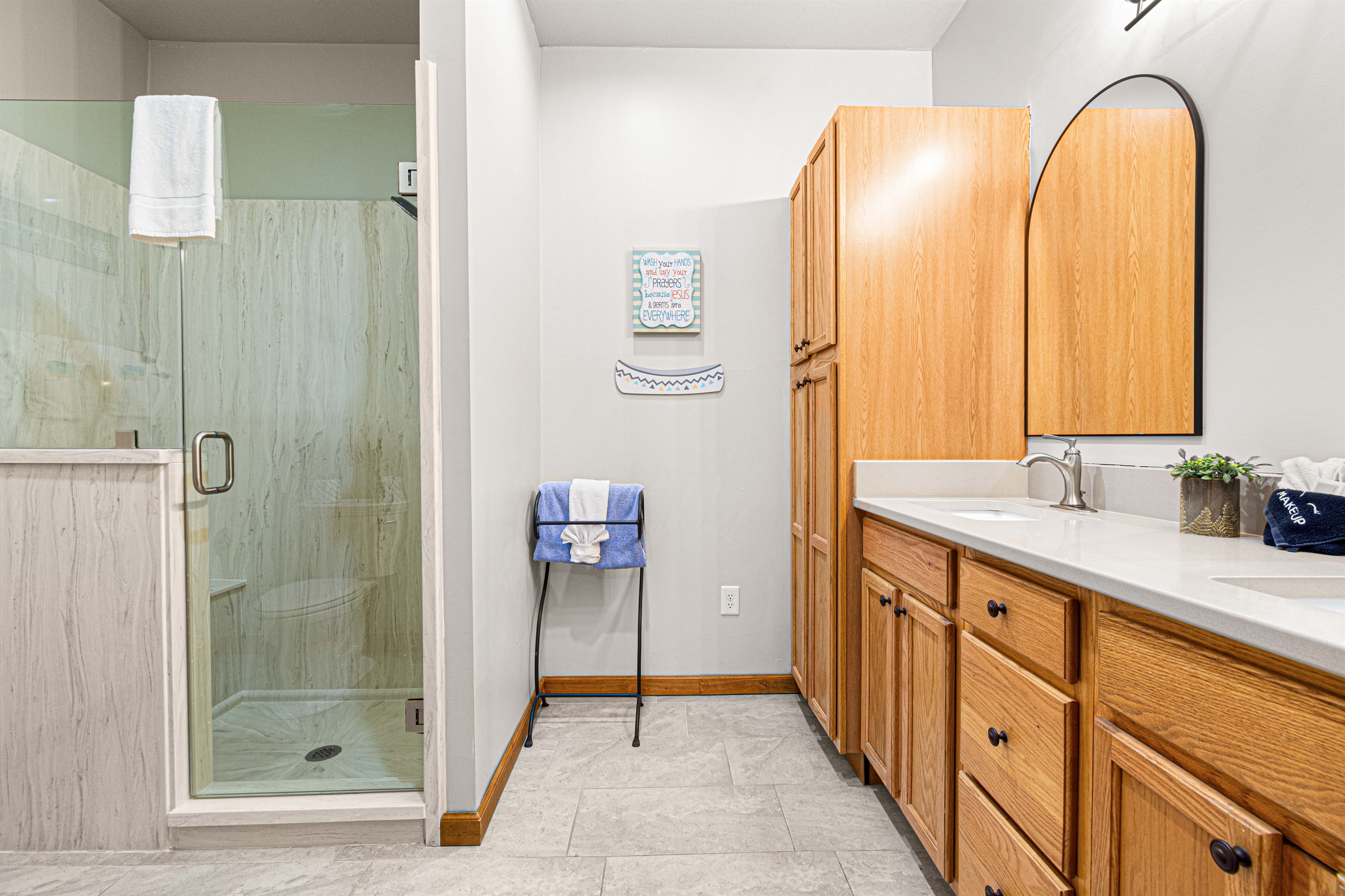 Large bathrooms were recently updated with walk-in showers and double vanities.