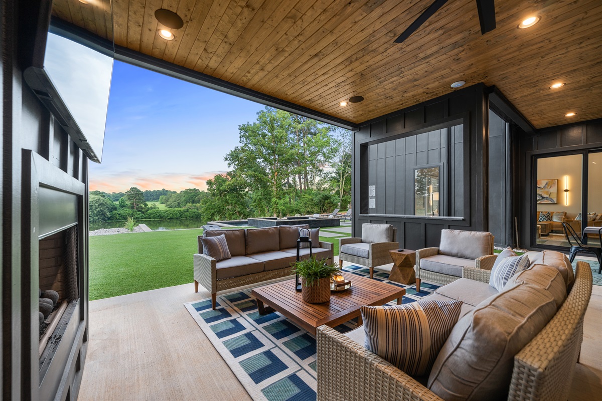 The outdoor fireplace adds warmth and ambiance for evening gatherings, enhancing the cozy atmosphere.