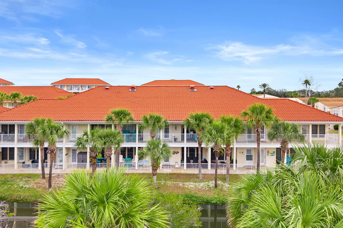 First-floor patio with peaceful lagoon views — perfect for morning coffee or evening unwinding. Quick, easy 2-minute stroll to beach access via sidewalk right out of your back door!