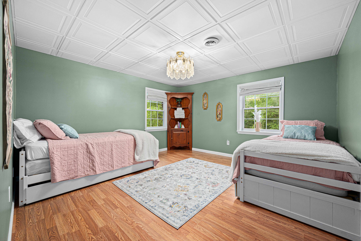 Guest Room: Bright and airy retreat with two beds and elegant touches—perfect for unwinding!
