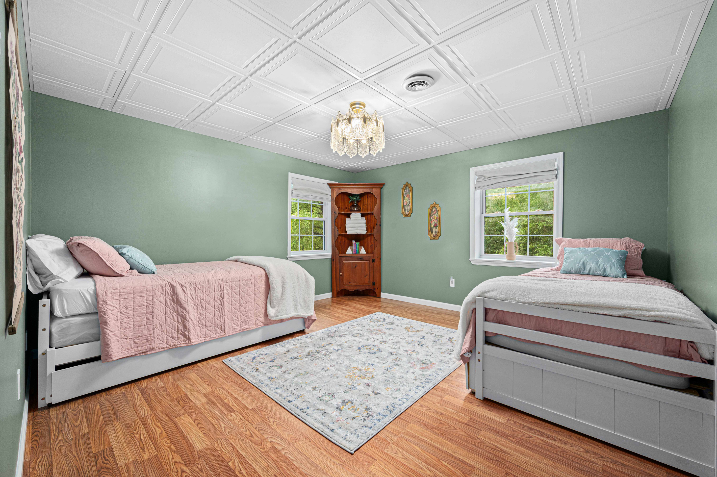 Guest Room: Bright and airy retreat with two beds and elegant touches—perfect for unwinding!