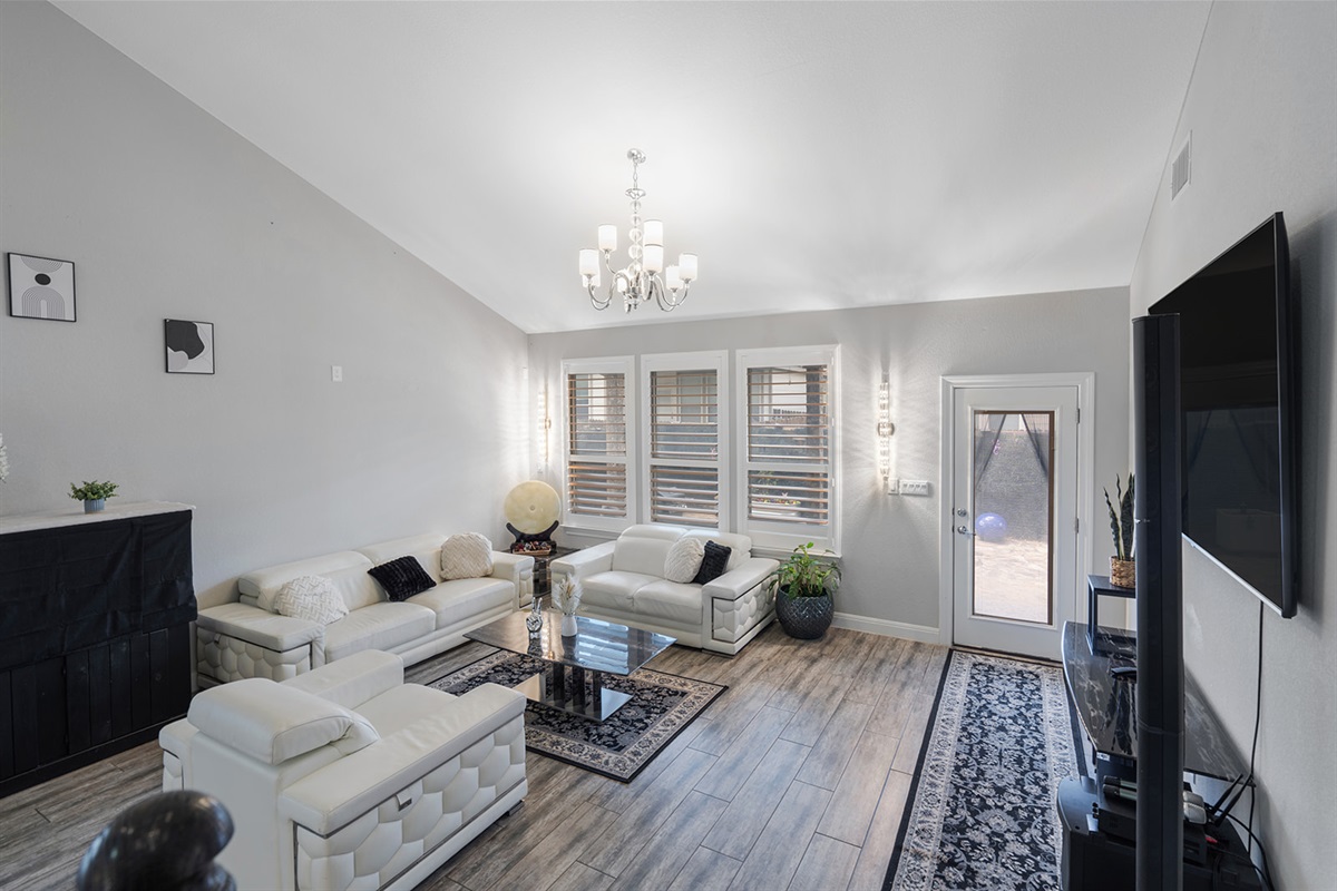 🛋 Living Room  “Cathedral ceilings, leather seating, and vibes that feel like vacation.”