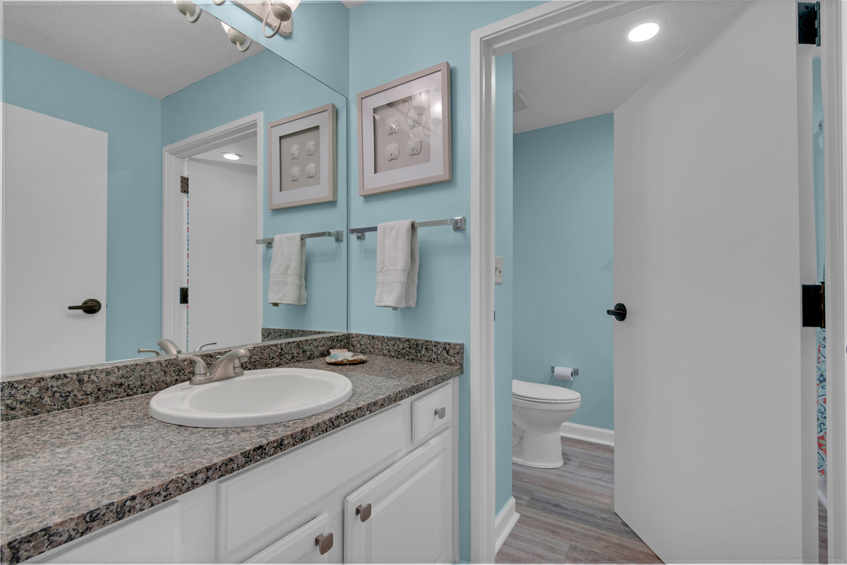 Front bathroom vanity; this bathroom is scheduled for an update in late 2026.