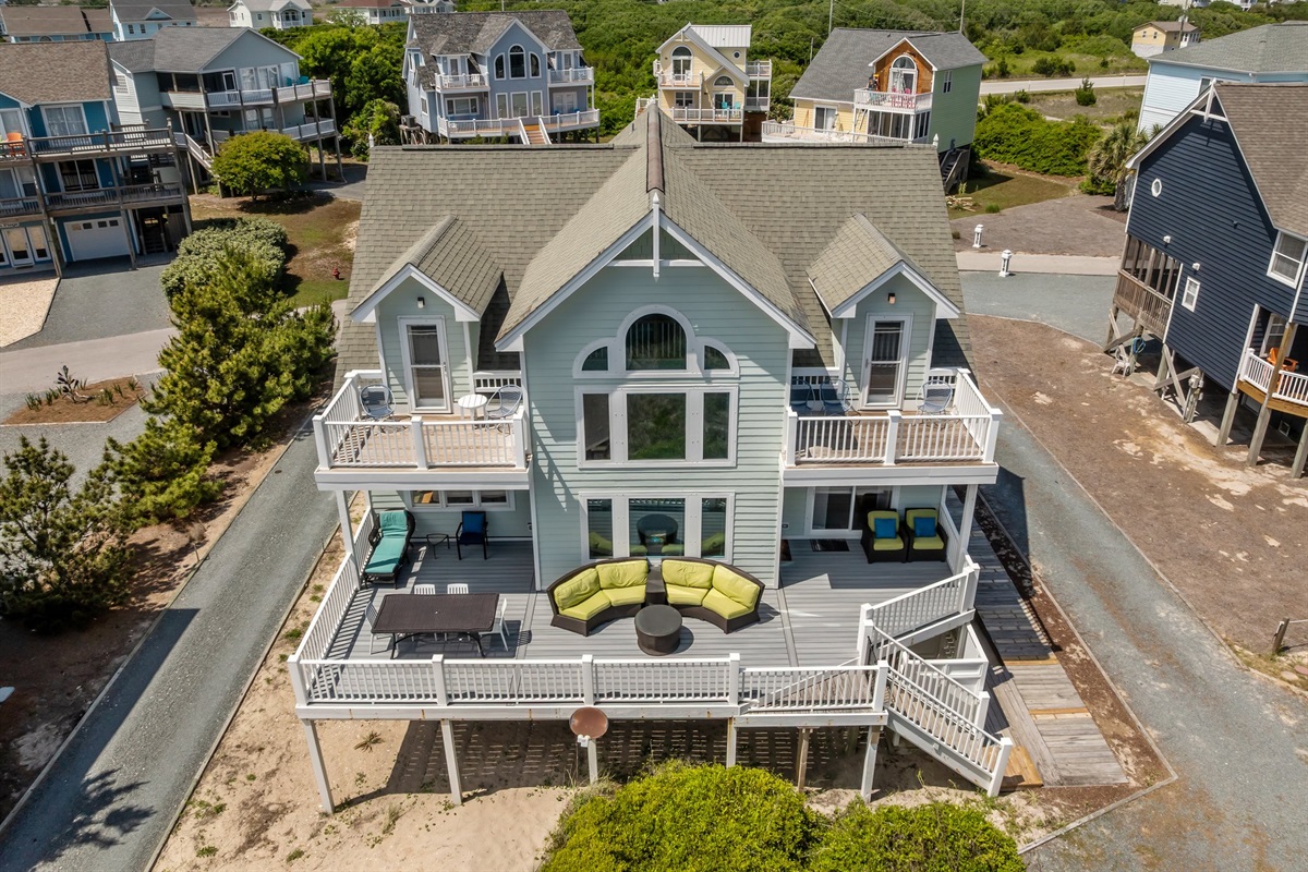 Multi-level home with a large spacious deck, ideal for social events and relaxation.