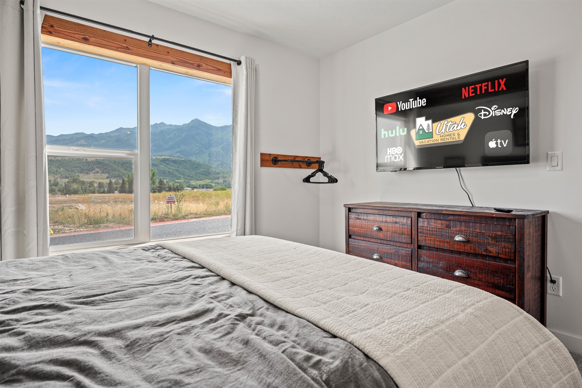 Unwind in bed as you stream your favorite shows on our smart TV!
