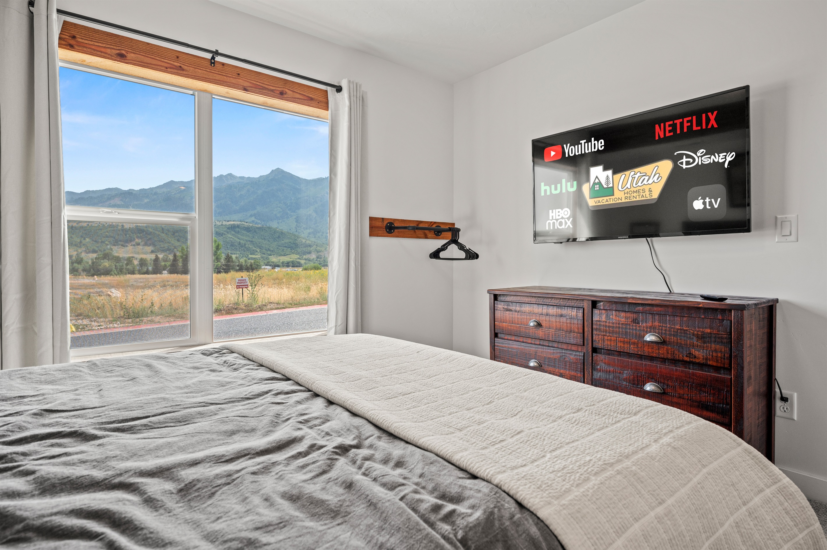 Unwind in bed as you stream your favorite shows on our smart TV!