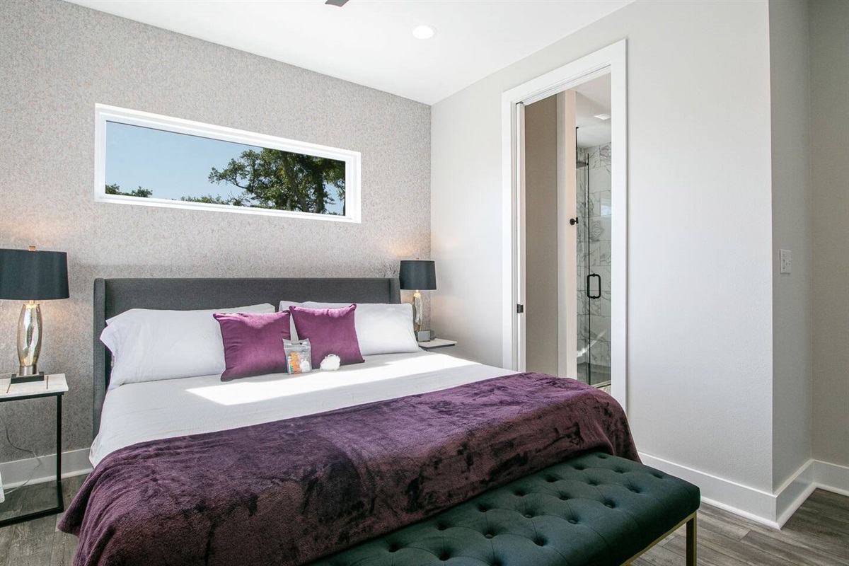 Purple is the color of royalty. Which is fitting for this comfortable "king" bed with memory foam mattress. Attached private bathroom. Plenty of natural light for sky views.