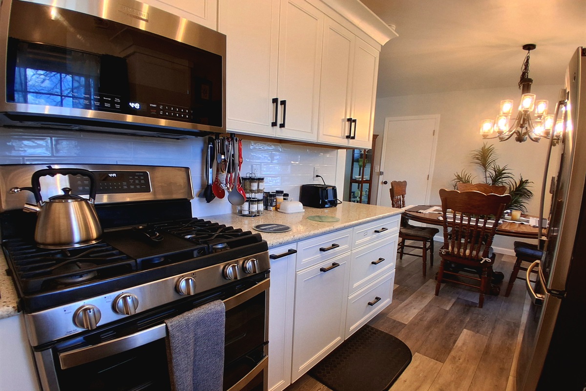 This double oven gas stove is a dream. The center top is a griddle for cooking big batches, and it features air fryer, convection, and standard bake modes. It self-cleans with steam and offers both a small top oven and a spacious bottom one.
