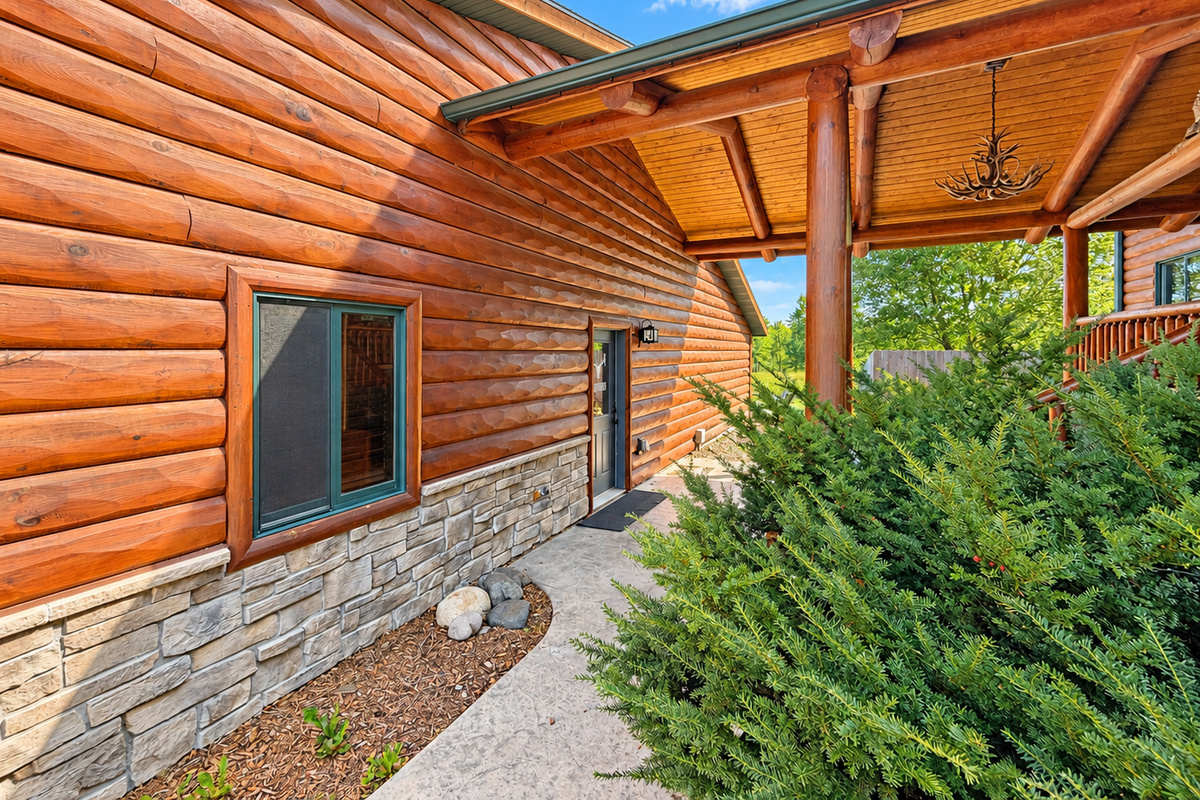 As you make your way in, Northwoods Antler Lodge sits to the left, offering an inviting first look at the property and its peaceful Northwoods setting.