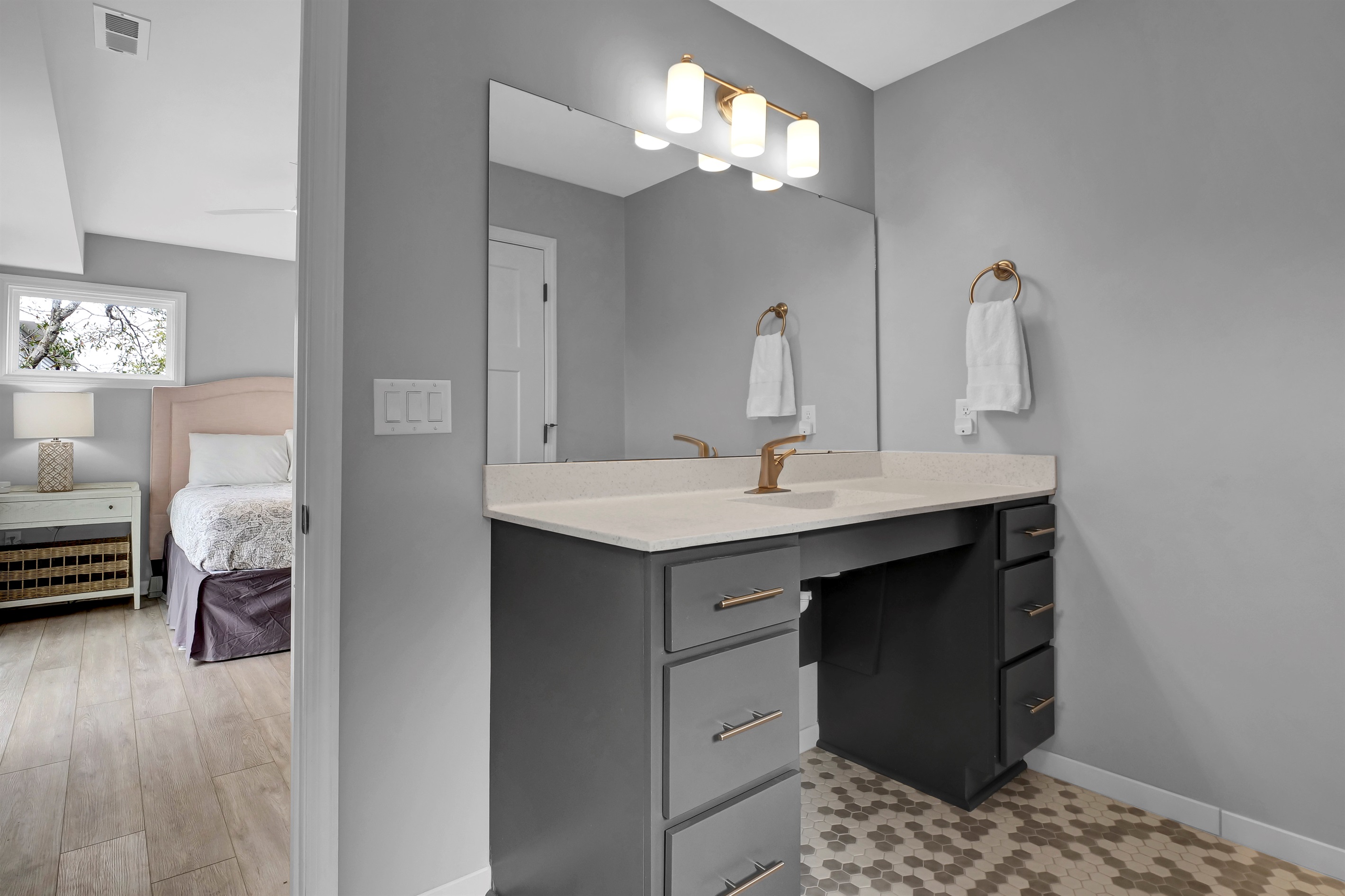 This thoughtfully designed bathroom includes a roll-under sink and vanity.