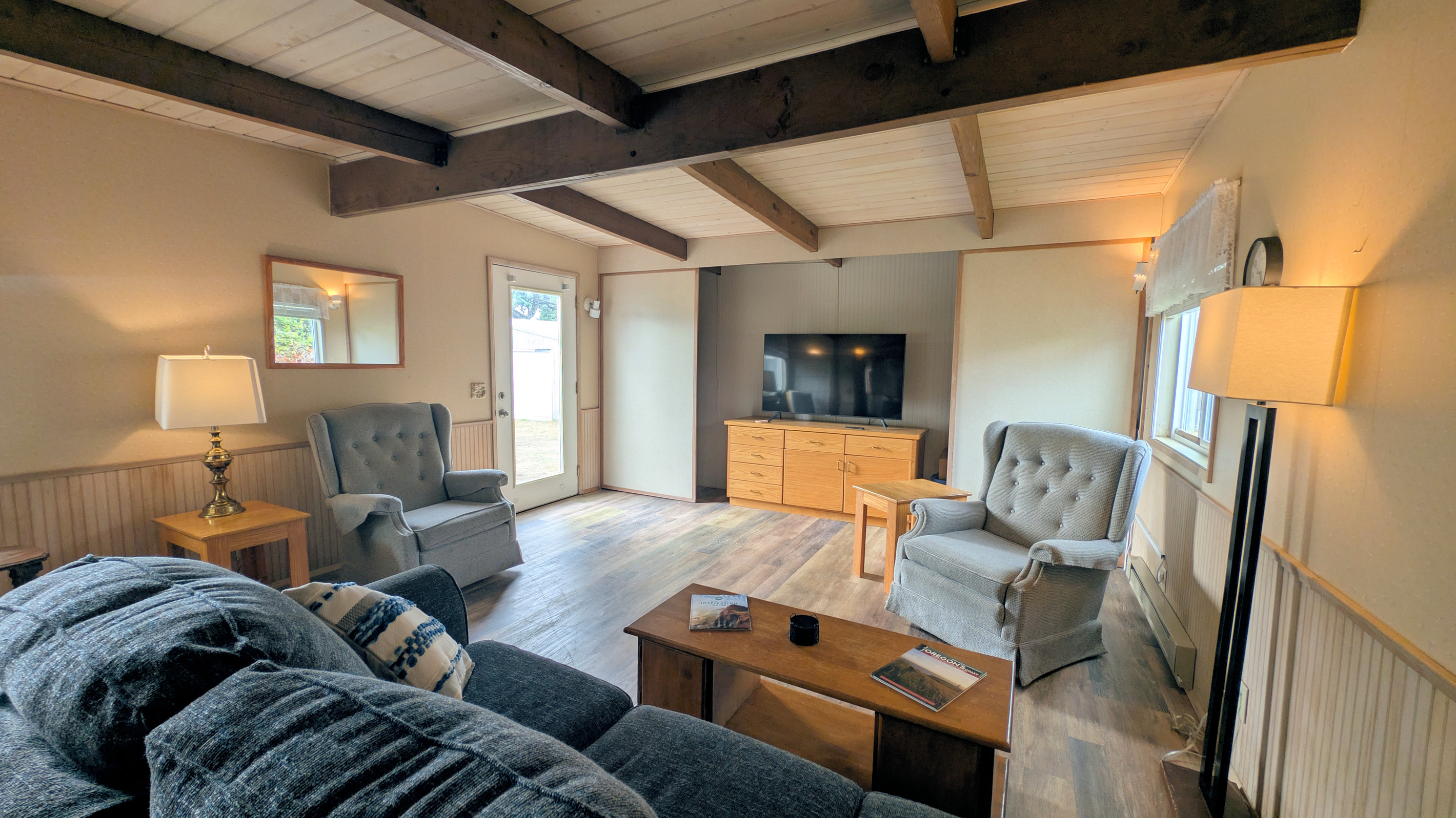 large living room with door to back deck/yard