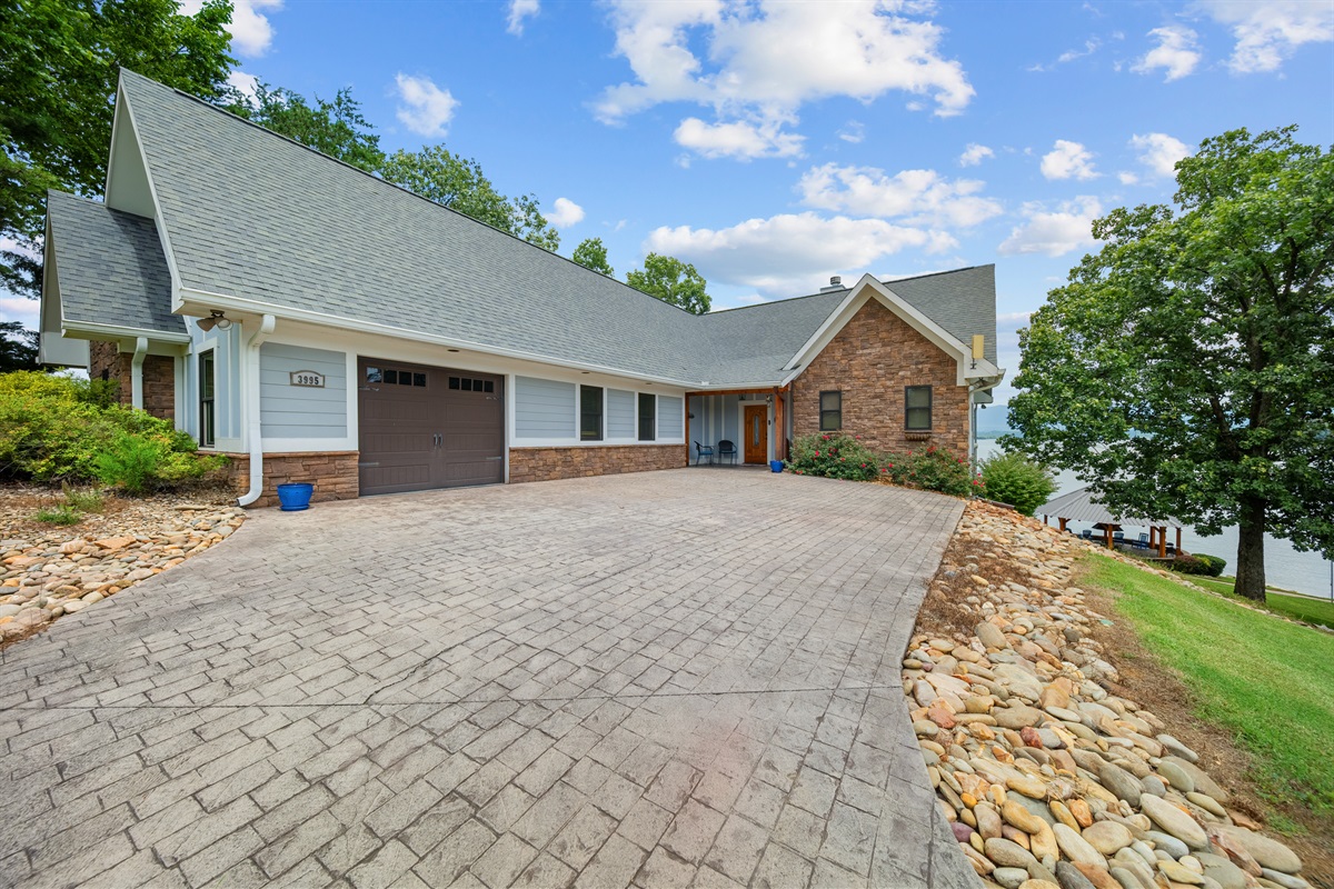 Park on concrete driveway or in the attached garage (no steps to entrance for top floor)