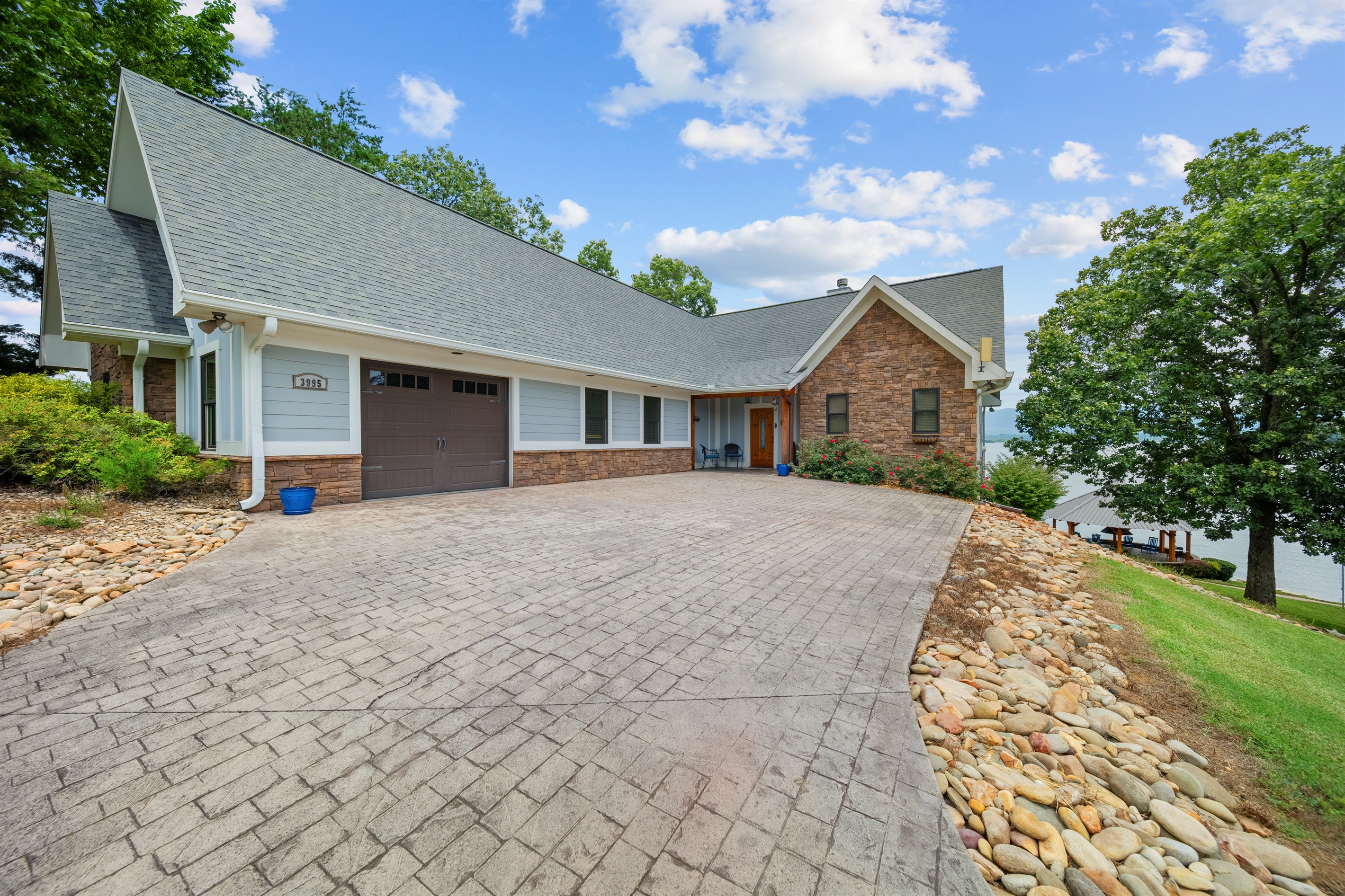 Park on concrete driveway or in the attached garage (no steps to entrance for top floor)