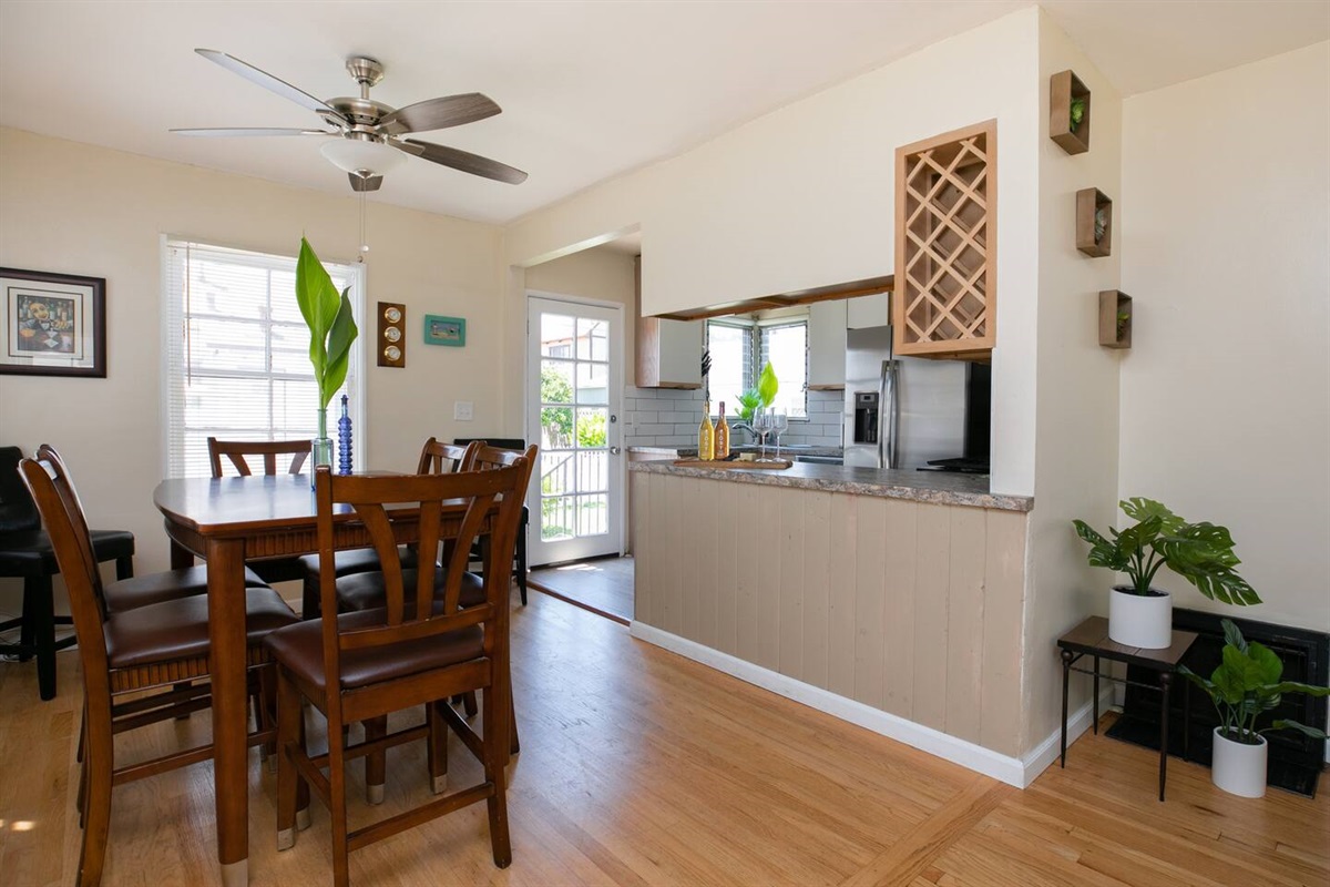 Entertaining is easy-breezy in this sleek kitchen. Center island, stainless steel appliances, gasstove, wine cabinet.