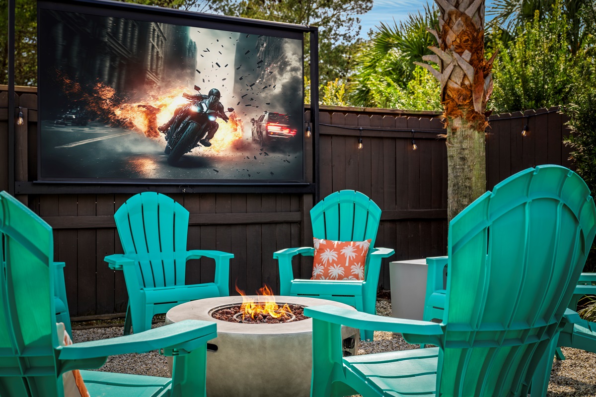 Movie night under the stars. Cozy up around the fire pit and watch your favorite film on the outdoor screen after a full day at the beach.