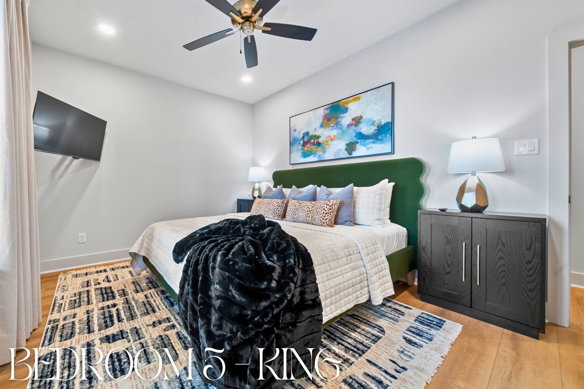 Another king bedroom with soft linens and a calming color palette &ndash; a serene retreat for peaceful nights and gentle mornings.