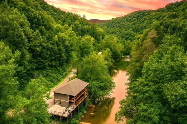 Imagine waking up to the sound of a rushing river below and ending the day surrounded by nature on your private deck. Perched above the Little Pigeon River, our cabin offers a unique blend of seclusion, river views, and private access to one of the Smokies