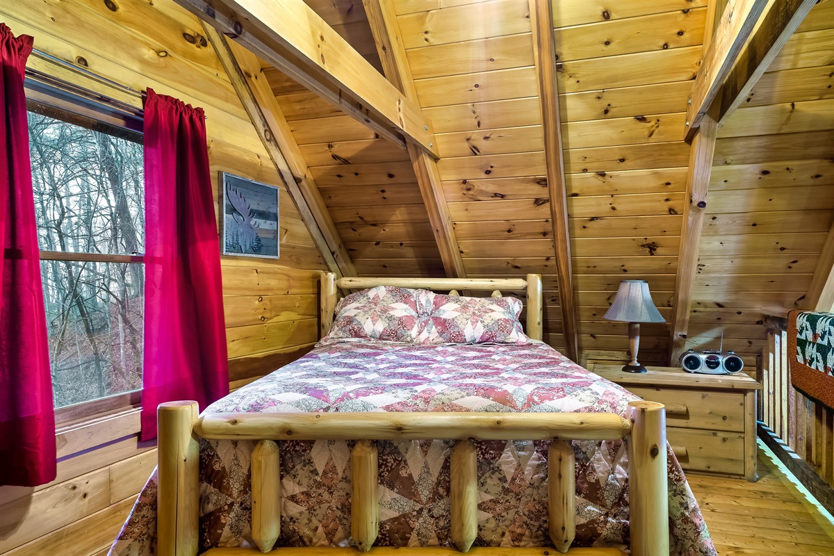 Loft bedroom area with queen-size bed