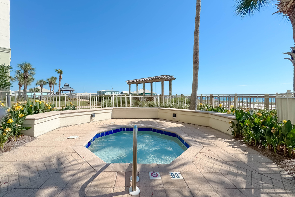 This inviting hot tub offers a serene escape with views of the surrounding resort amenities.