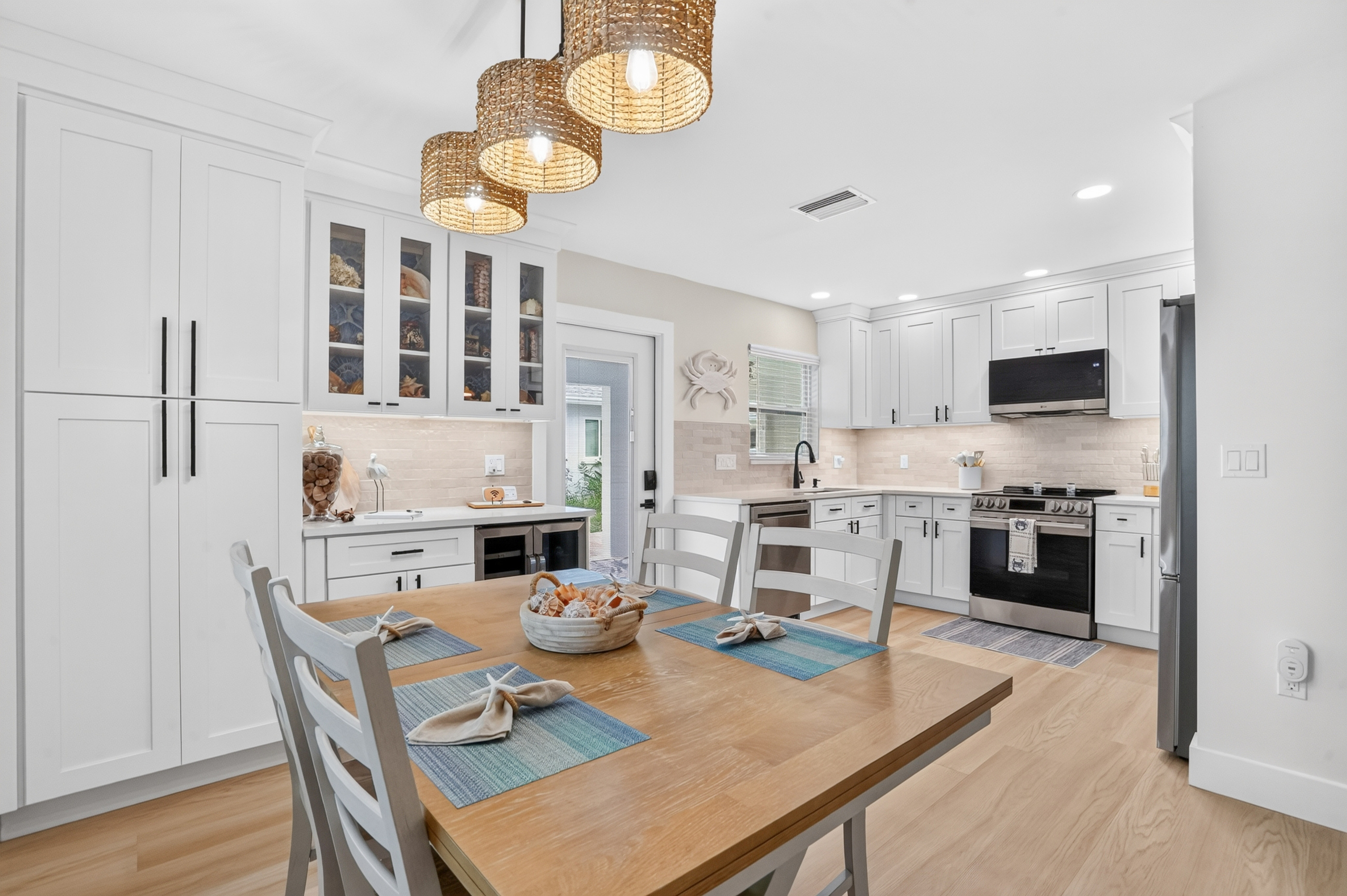 The open dining area flows naturally into the kitchen, creating a bright and welcoming space for shared meals.
