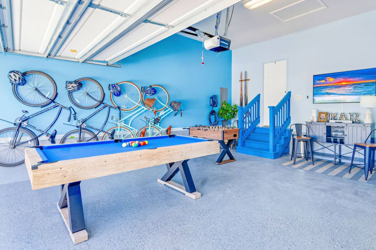 Enjoy friendly competition in the game room with a mini pool table, foosball & mini bar with Smart TV. 
