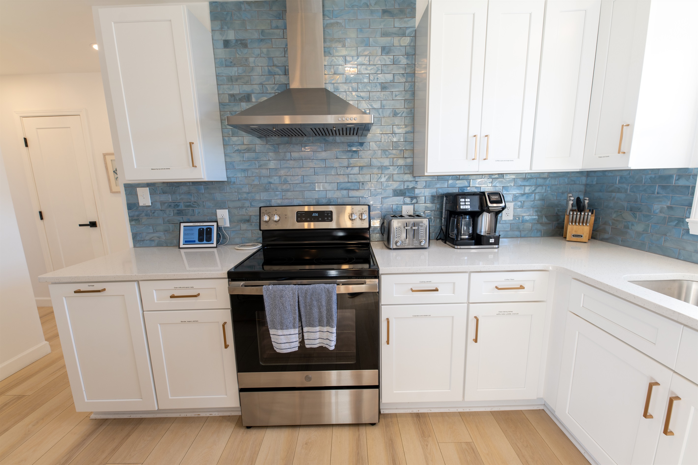 Start your day with a cup of your favorite coffee/tea whether by K-cup or fresh grounds in the Hamilton Beach FlexBrew station while making breakfast in the stunning coastal kitchen