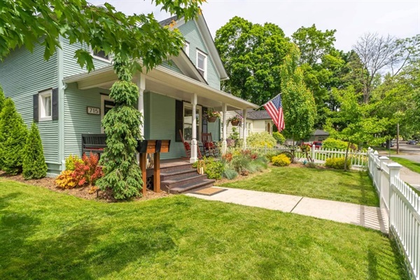 A tree-filled yard yard with a perfect balance of sunshine and shade.