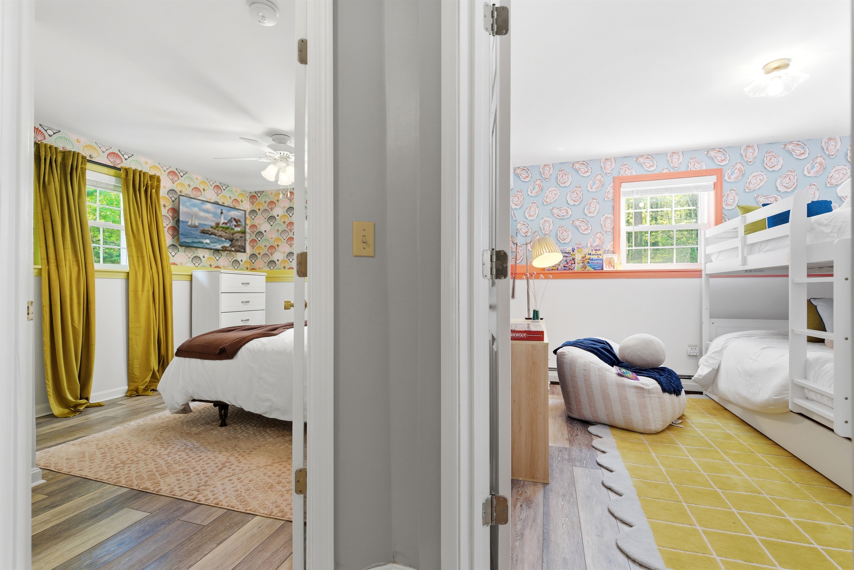 A split view of the bedroom featuring two bunk beds with full-sized beds on the right and a twin trundle bed on the left.