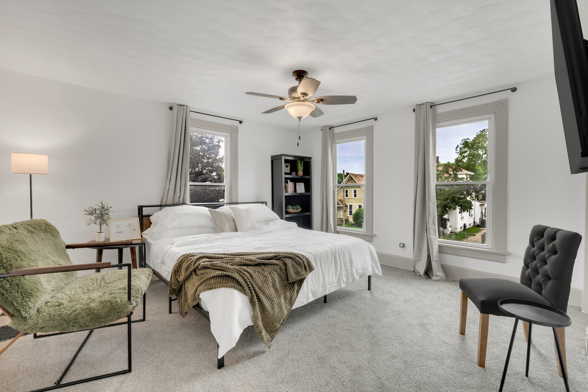 King, primary bedroom with smart tv w/streaming access. Walk-in closet and access to laundry.