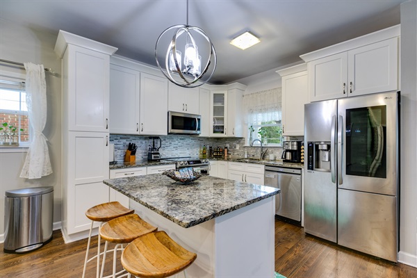 Cook together in our fully stocked, modern kitchen — with sleek stainless steel appliances, spacious island seating for 3, and all the essentials for family meals.