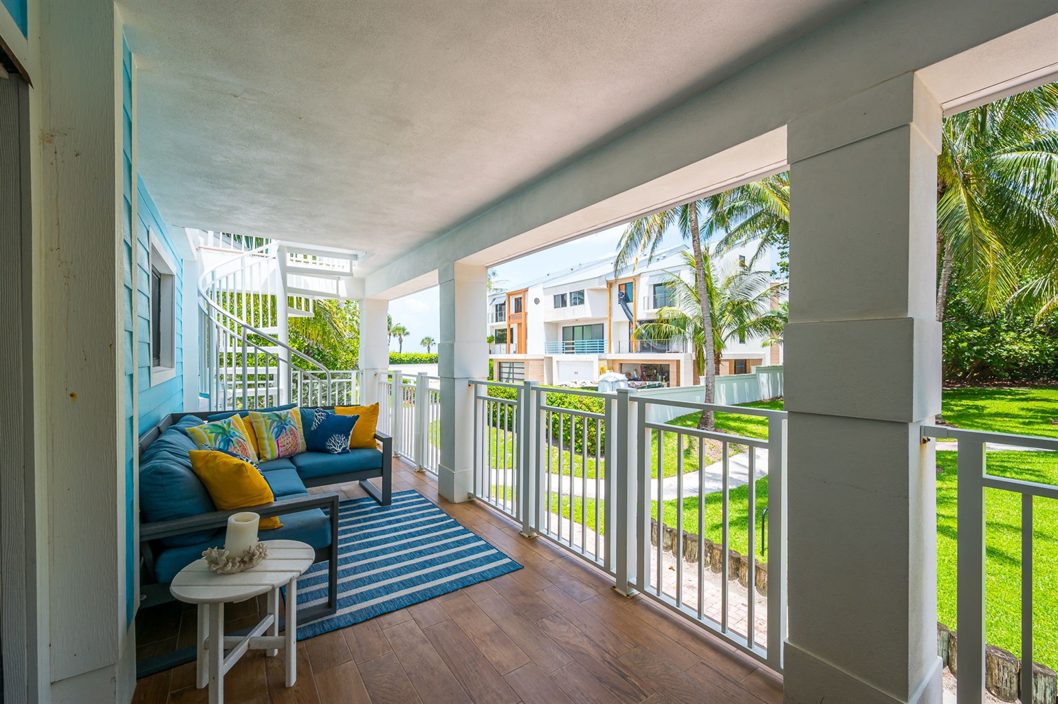 Private balcony surrounded by lush greenery, featuring outdoor dining and seating—perfect for morning coffee, al fresco meals, or evening relaxation.