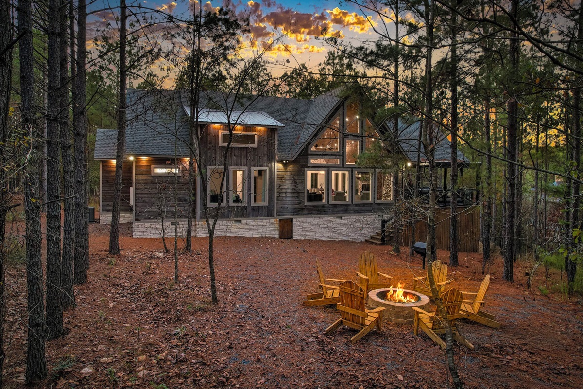 Evening exterior view of Hillside Haven illuminated at dusk.