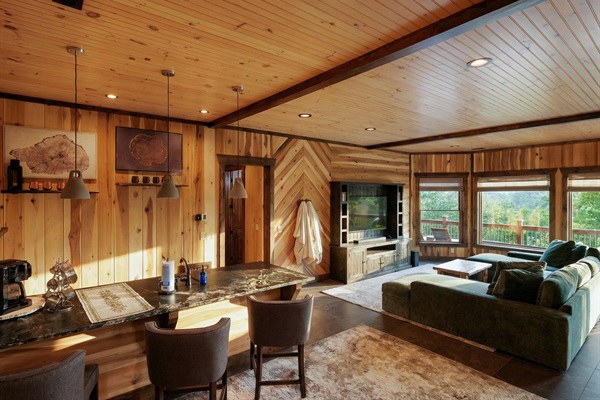 Kick back in the bar and lounge area, perfect for a casual evening drink or game night with friends.