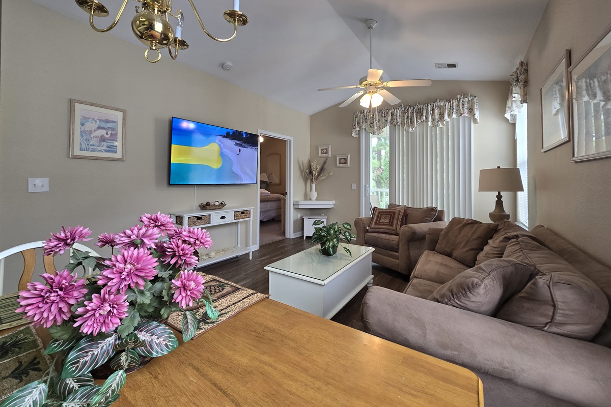 Cozy Living Space with Large, Mounted Flat Screen TV