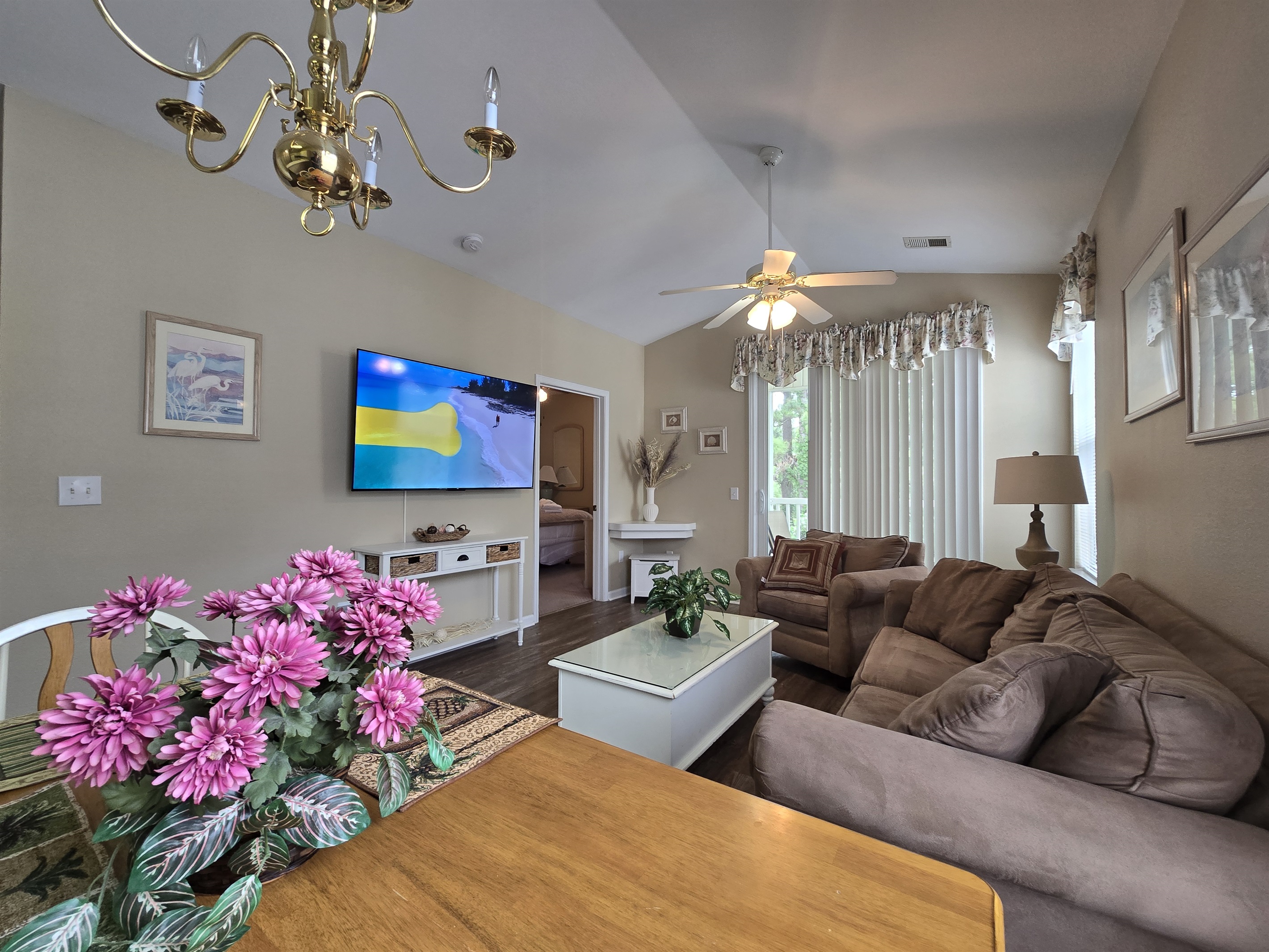 Cozy Living Space with Large, Mounted Flat Screen TV