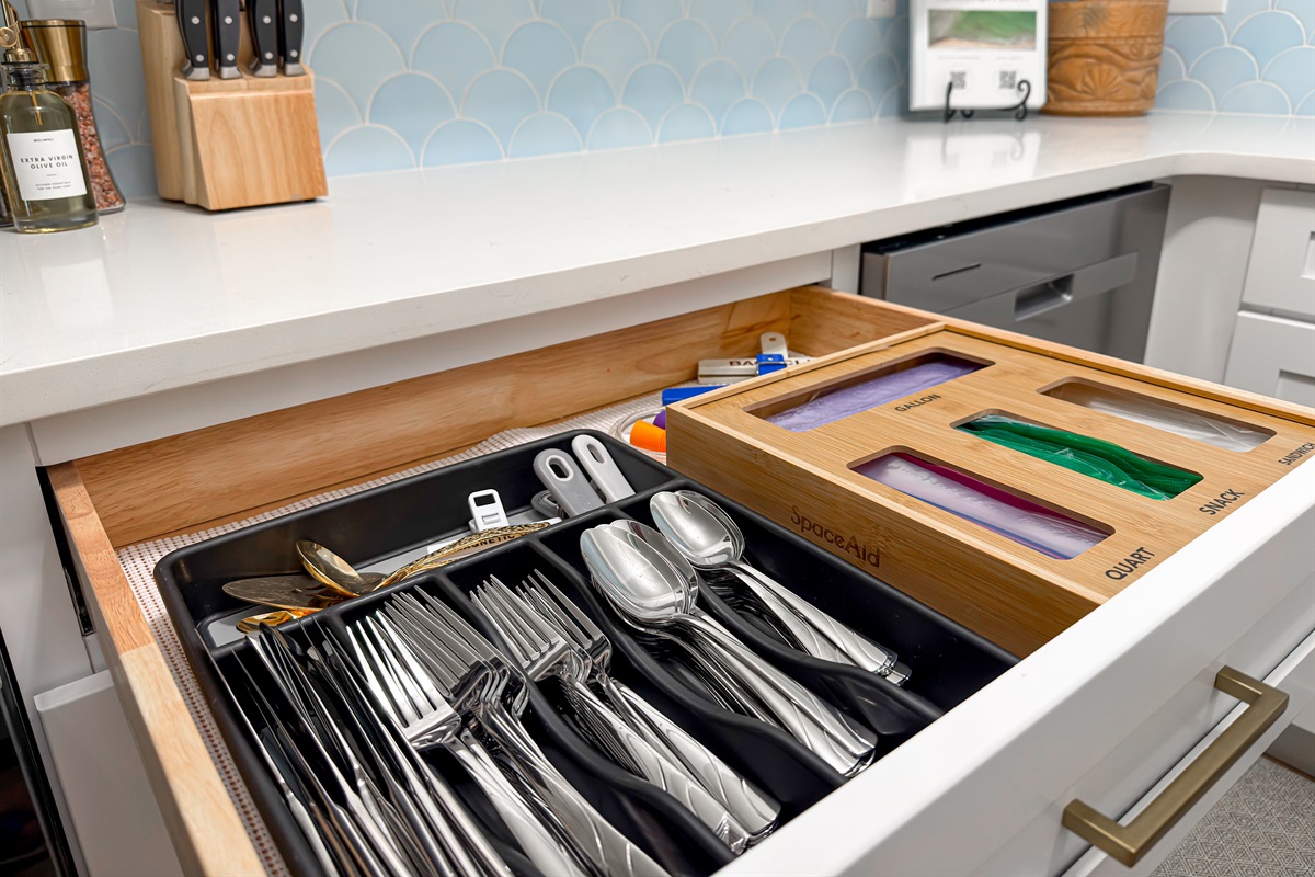 You will find plenty of silverware, plates, bowls, and glassware in the cabinets, so you don't have to run the dishwasher after every single meal.