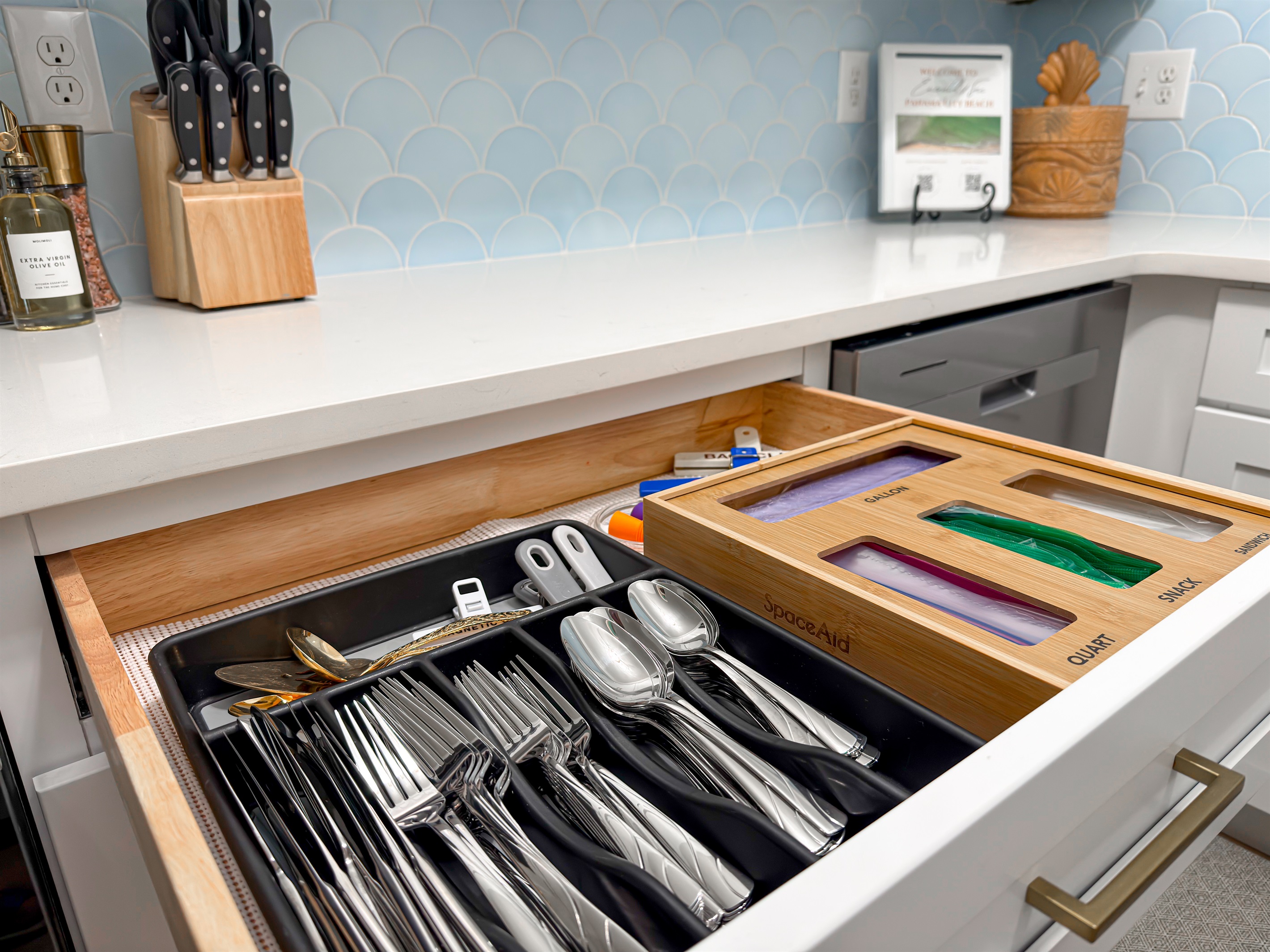 You will find plenty of silverware, plates, bowls, and glassware in the cabinets, so you don't have to run the dishwasher after every single meal.