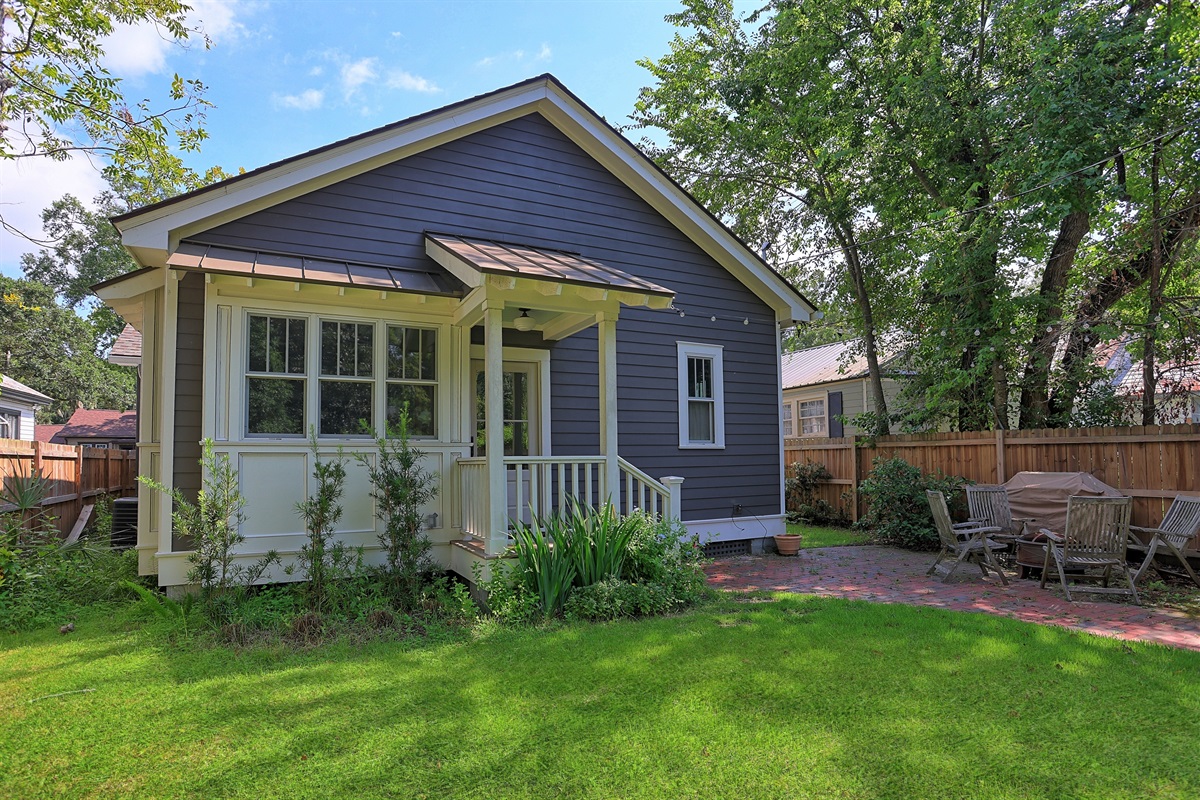 A charming view of the bungalow’s rear, where indoor comfort meets outdoor serenity.