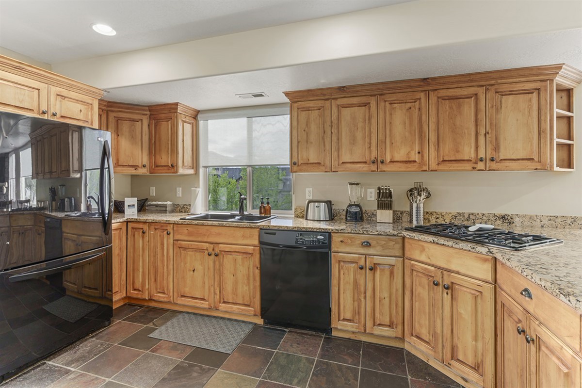 A fully equipped kitchen with rustic charm and everything you need to cook and enjoy meals together.