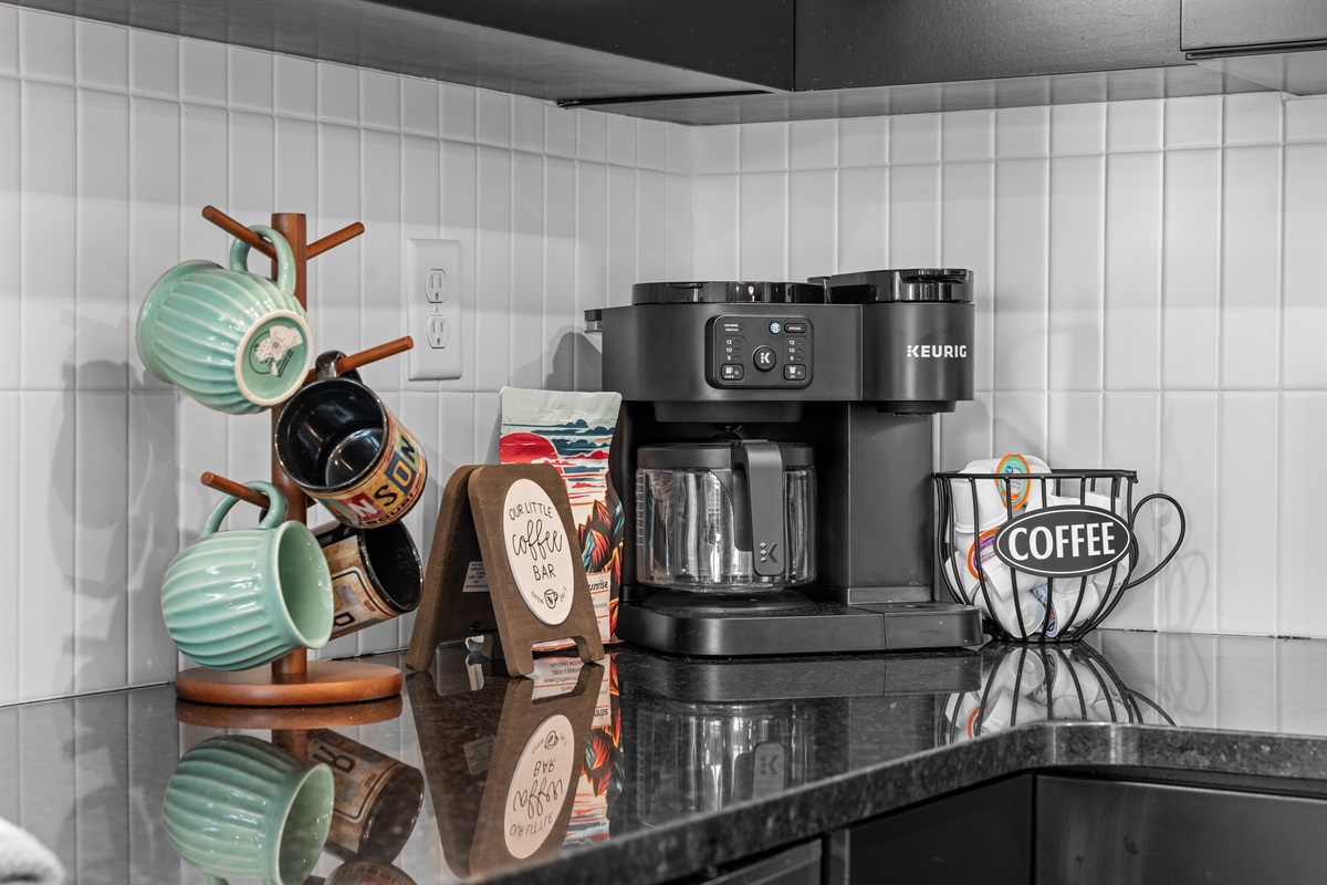A coffee station with a Keurig Duo coffee maker. It will do both K-Cups and drip coffee. Gotta stay caffeinated!