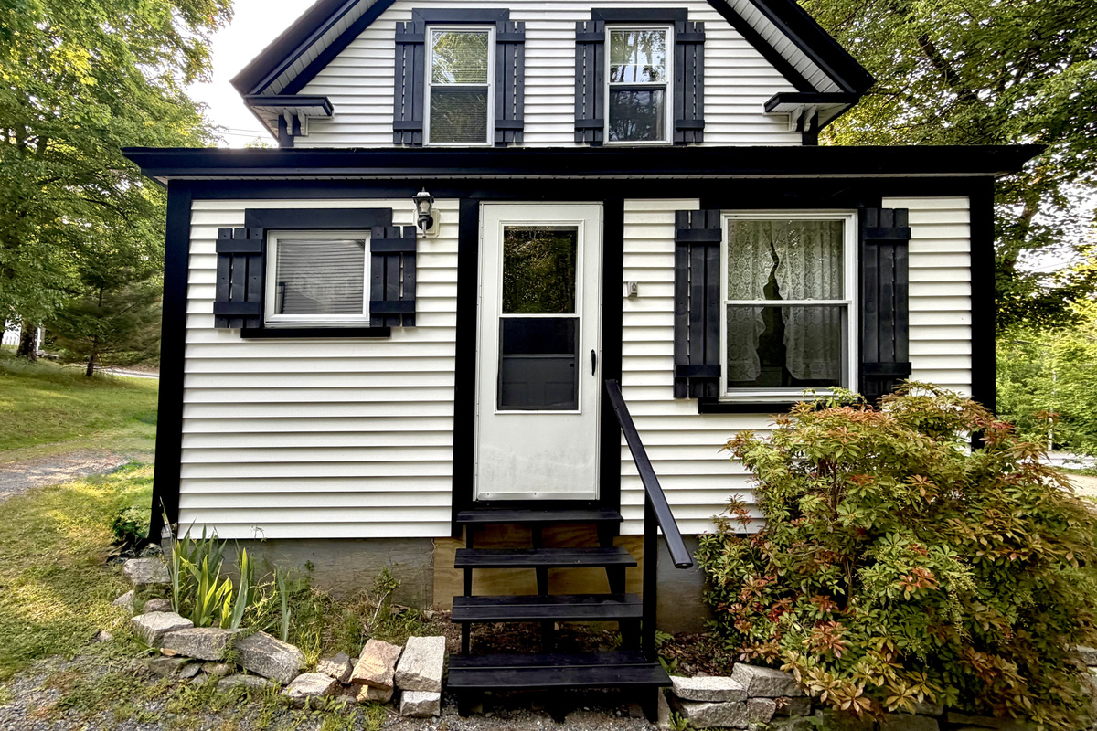 Welcome home. The main guest entrance opens directly into a convenient entry area, laundry nook, and kitchen. This functional setup makes unpacking your bags and settling into your classic MDI basecamp entirely seamless and easy.