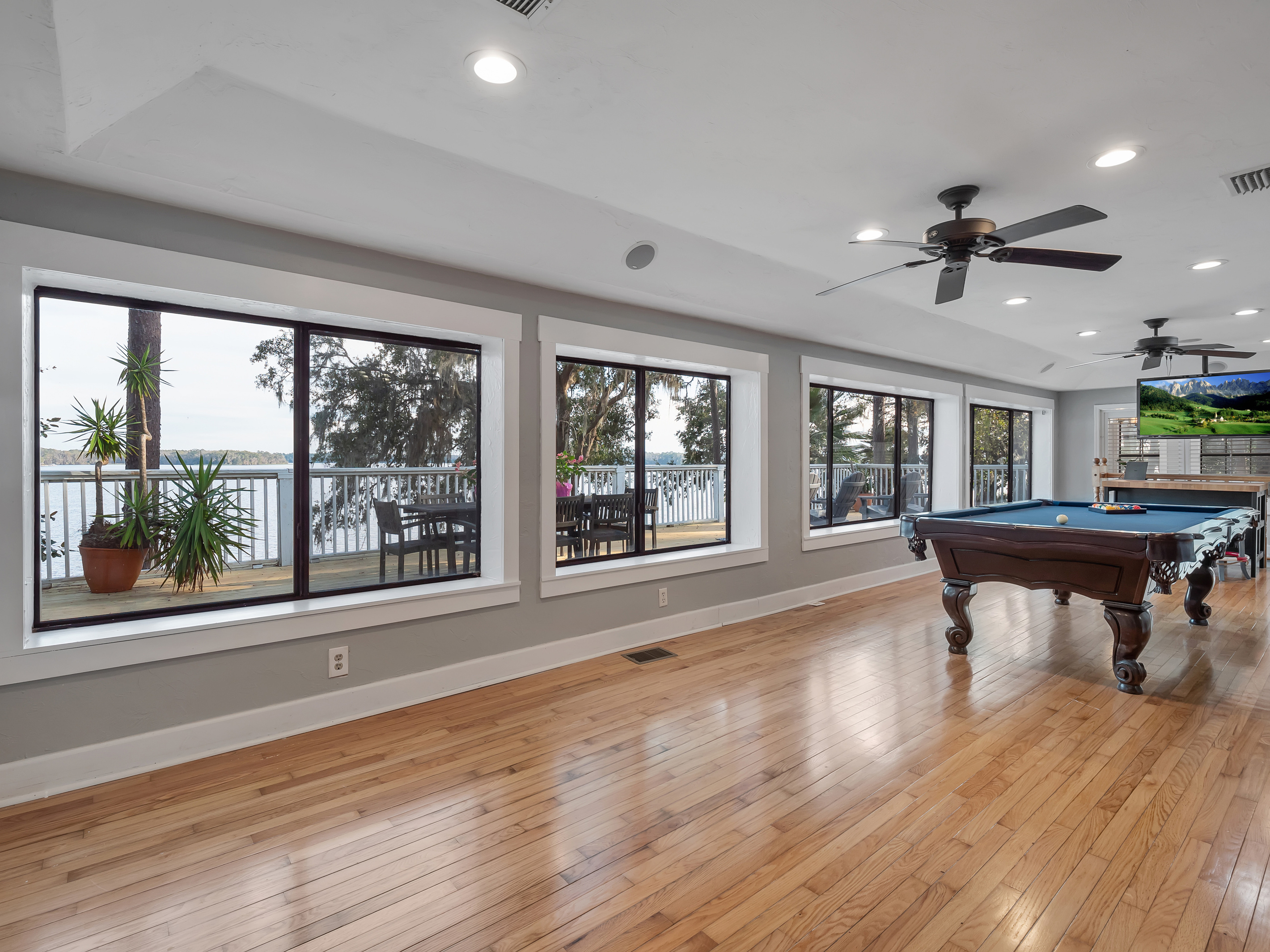 Pool table, lake view, stool seating, tv