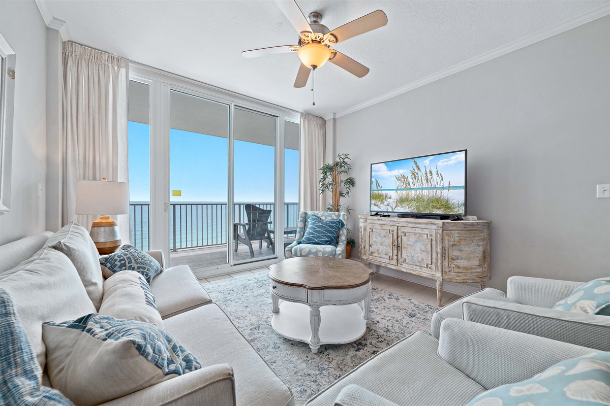 Experience the beauty of indoor-outdoor living with expansive sliding doors leading to a private balcony overlooking the ocean.