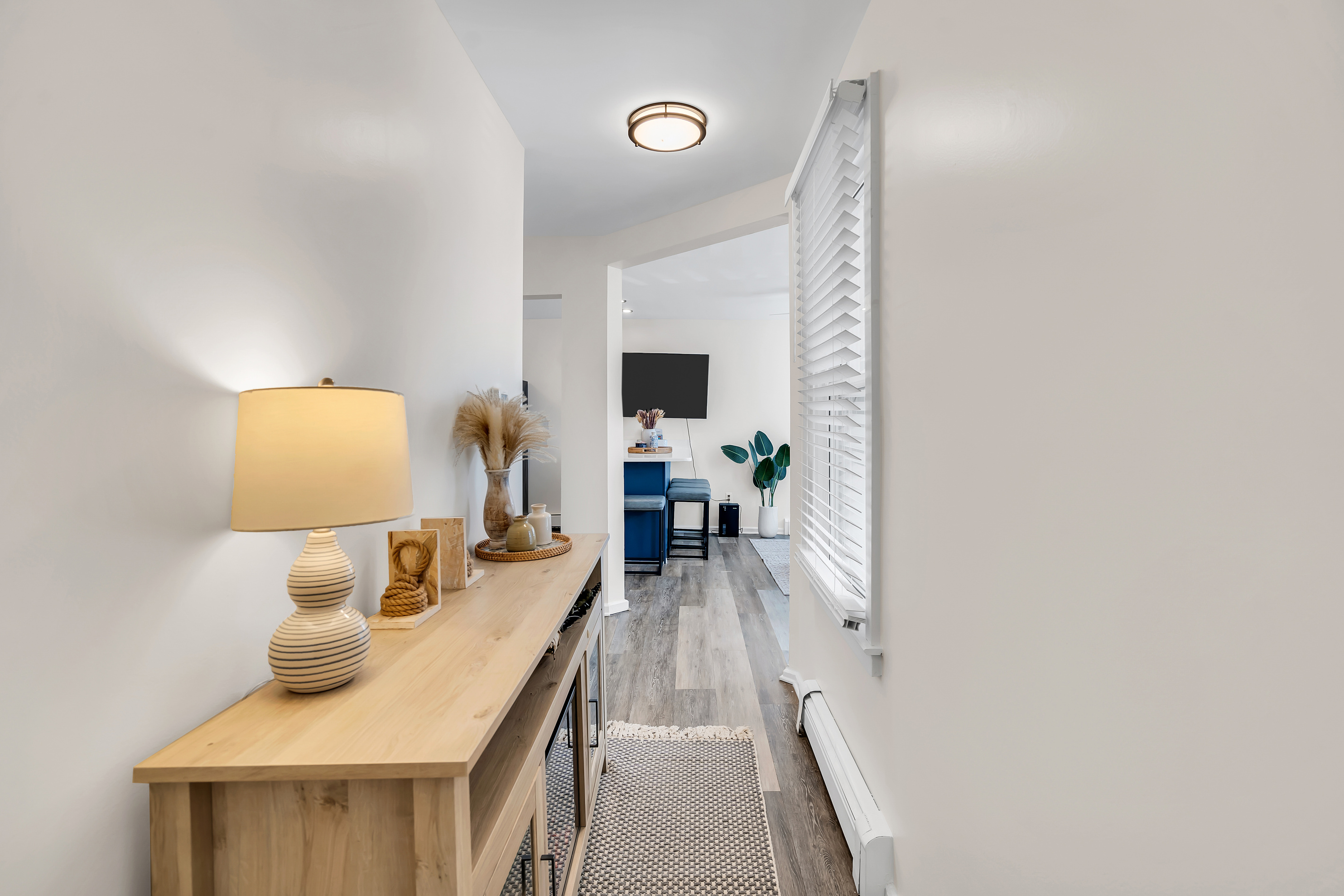 Wander from the bedrooms toward the kitchen for that first cup of coffee. The layout is simple and open, so nobody is ever far from the action.