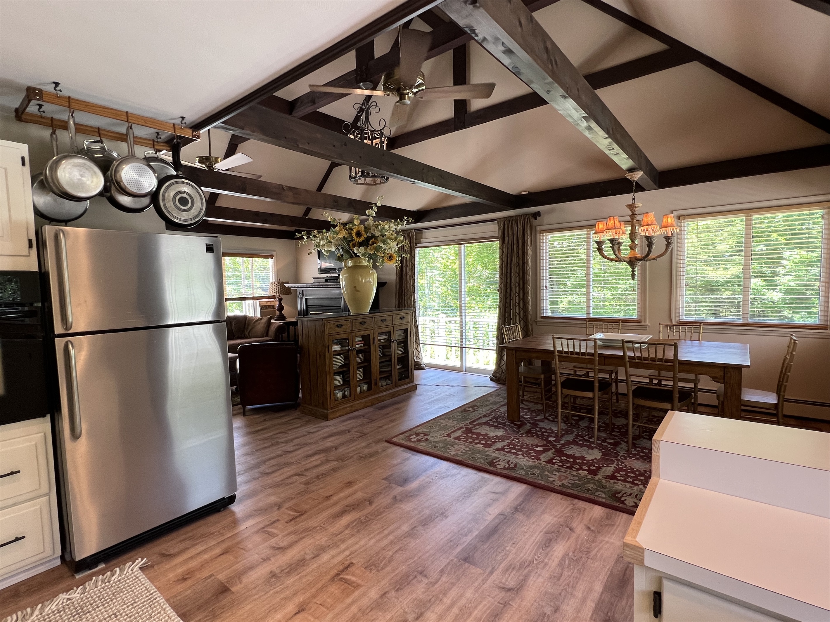 Open concept living area with cathedral ceilings to loft