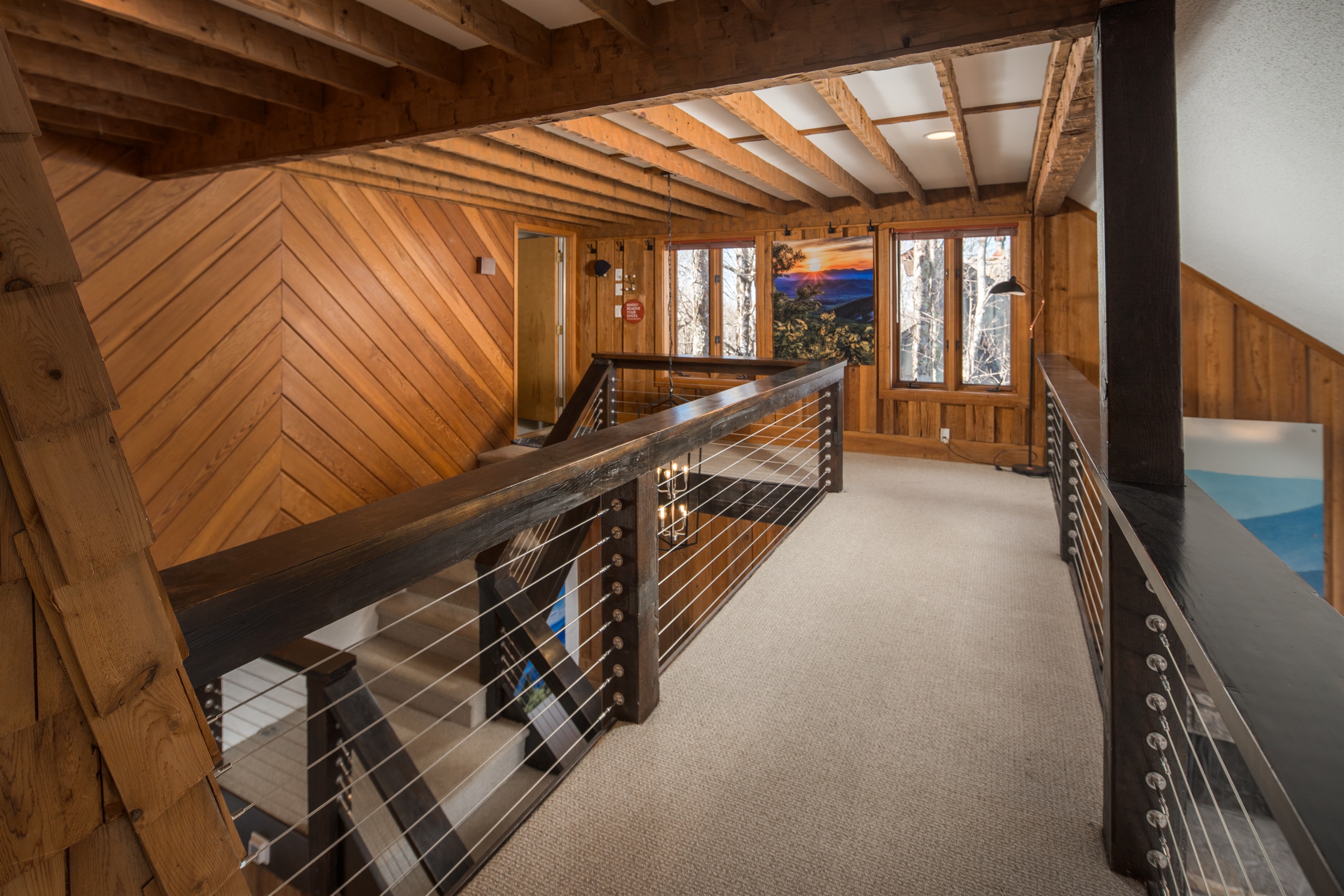 Garage/Top Floor Level - Entry from garage/side door/mudroom. You'll find a convenient half bath, plenty of hooks for drying ski jackets, and stairs leading down to kitchen/family room level.